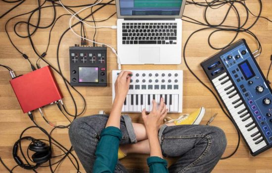 Film Composer writing music on at home setup