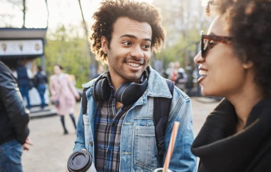 1st Assistant Director talking to colleague on location