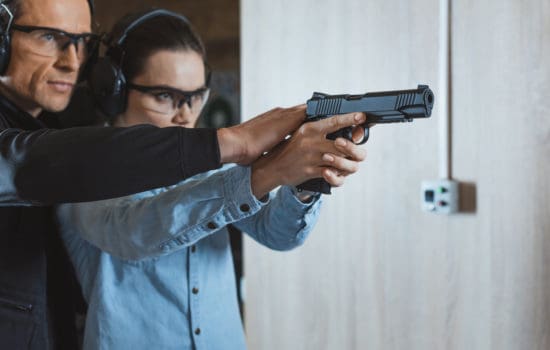 Armorer showing actress how to shoot a gun