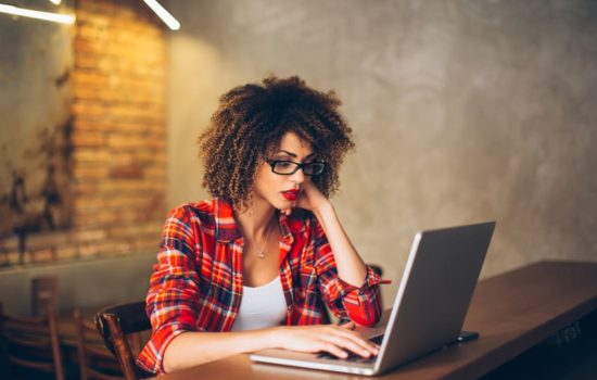 Script Supervisor looking over a script on her laptop