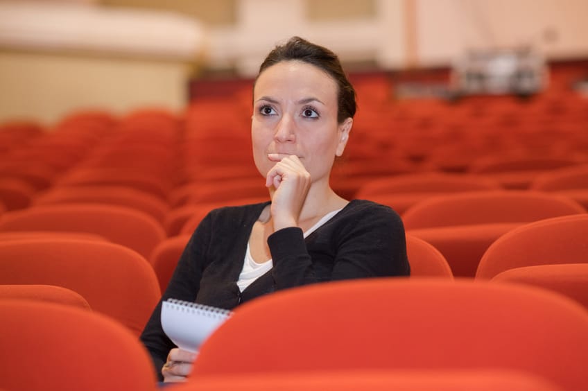 Casting associate sitting in empty theatre