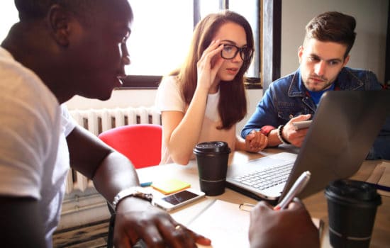 Co-producer in production meeting with her team