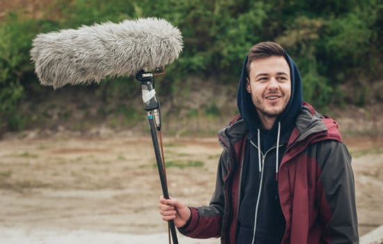 Boom Operator smiling on outdoor shoot