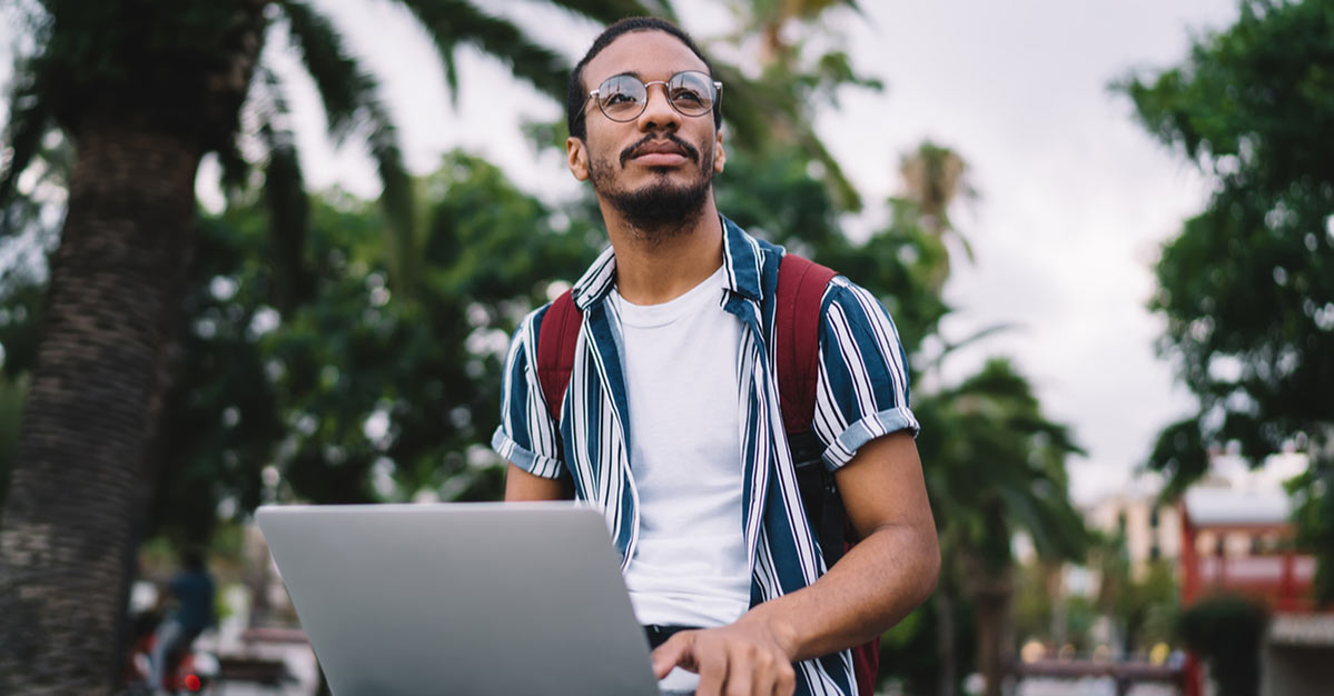 Young Black male Screenwriter on his laptop