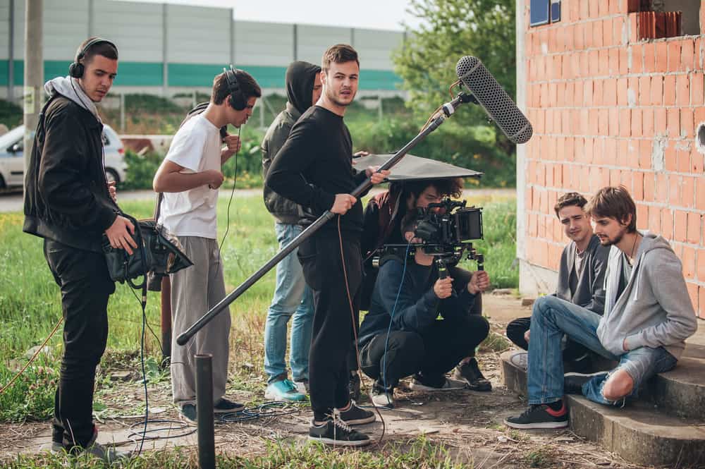 Film crew with sound and camera departments on location