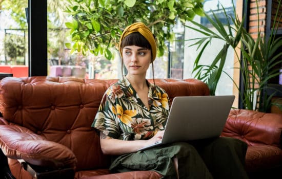 Actress writing her acting resume on a laptop