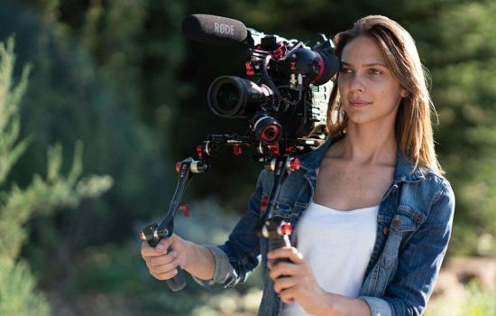 Female camera operator on outdoor shoot
