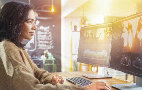 Film Editor editing a video on her computer