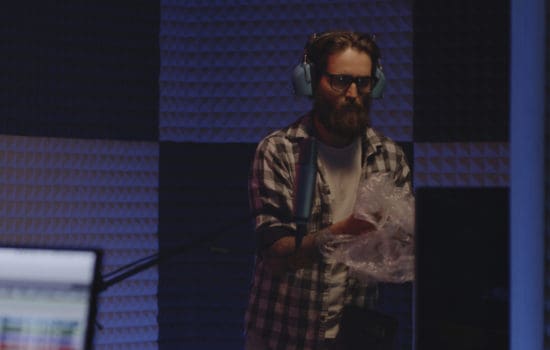 Foley sound artist creating effects in studio