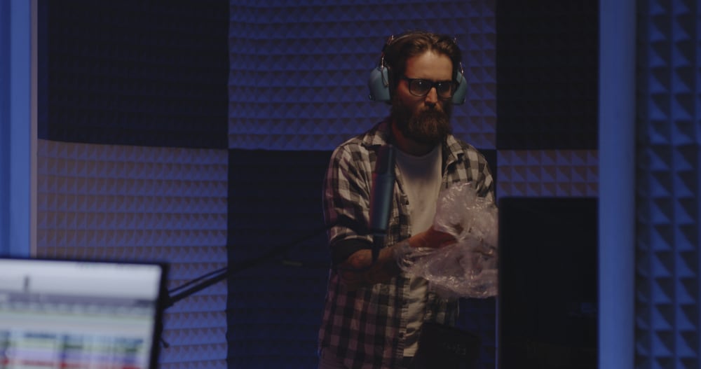 Foley sound artist creating effects in studio
