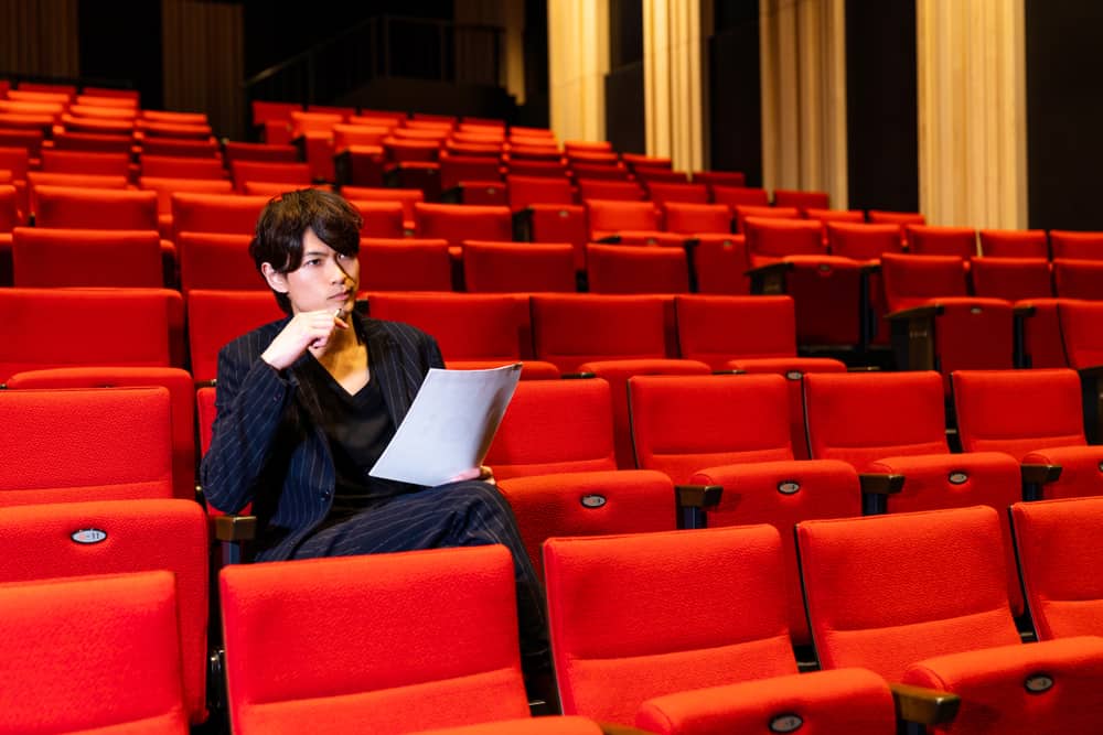 Filmmaker Outreach Programmer sitting in empty theatre