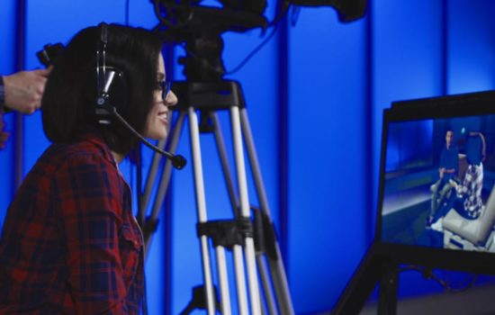 TV Producer watching filming on a monitor