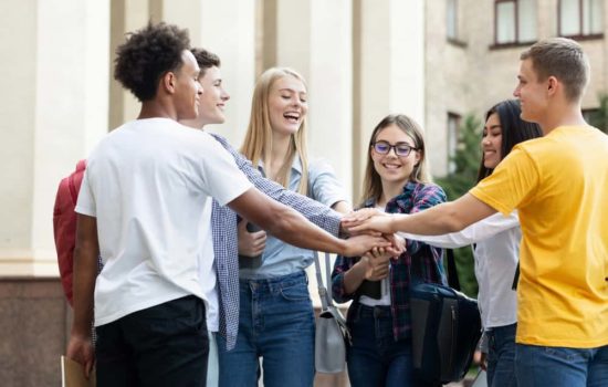 Diverse group of film school students on campus