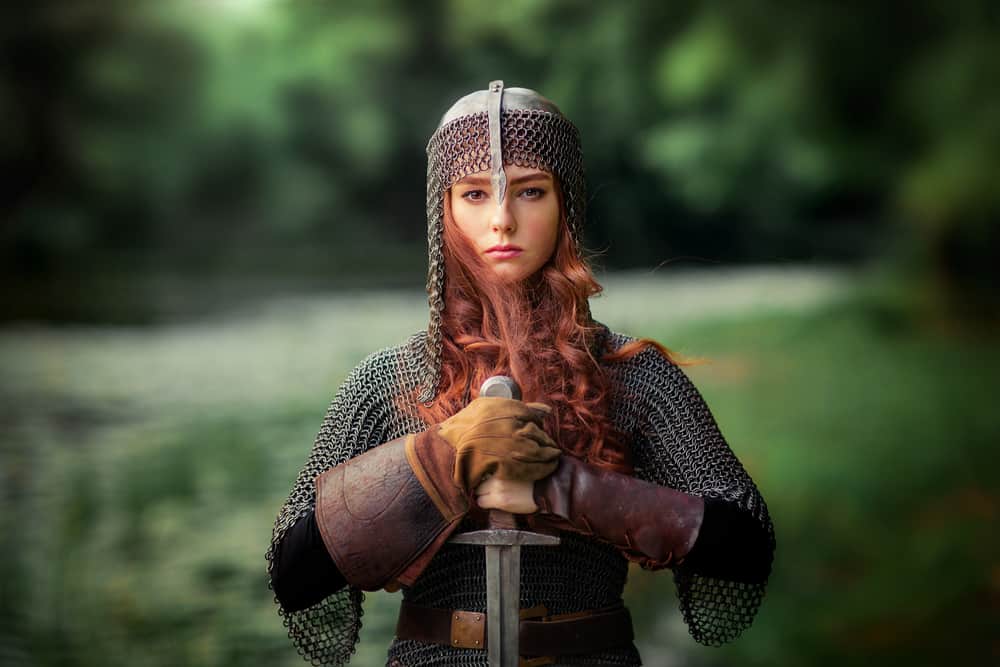 Actress dressed as a medieval warrior with sword