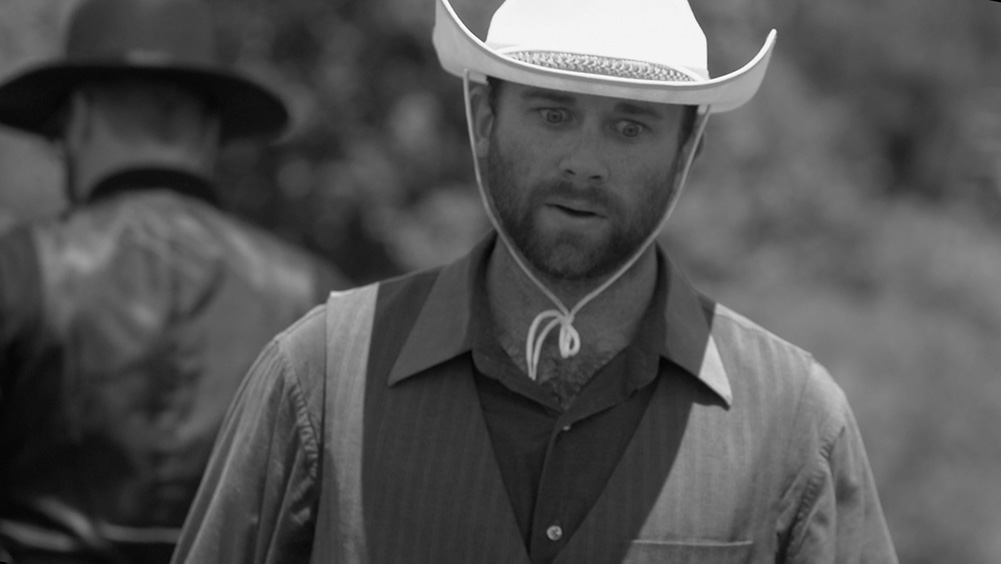 Dutch camera angle of cowboy in Western movie